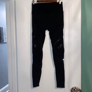 Black alo yoga pants, size large. Gently used! Hole pattern throughout the legs.